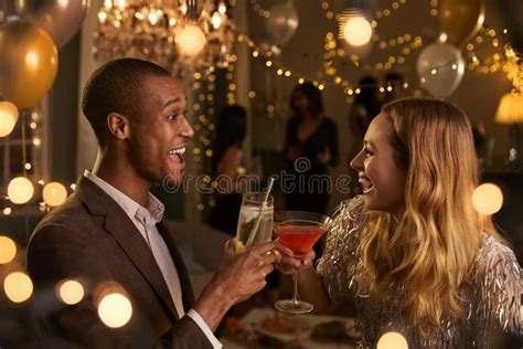 Couple Make Toast As They Celebrate At Party Together Stock Image
