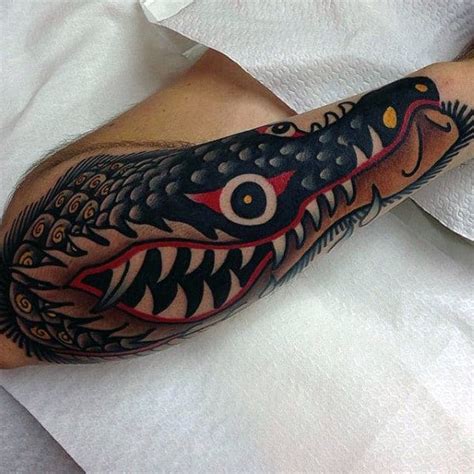 Alligator tattoo meanings itattoodesigns com traditional alligator tattoo, alligator crocodile tattoo design variations your tattoo design can incorporate any number elements from tribal patterns to comical cartoon characters alligator and crocodile tattoos come in a variety of colors and sizes. 100 American Traditional Tattoos For Men - Old School Designs