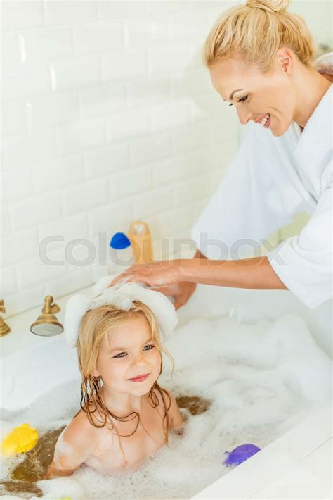 Mother Washing Daughter In Bathtub Stock Image Colourbox