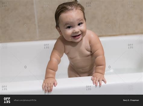 Baby Boy Standing In Bathtub Stock Photo Offset