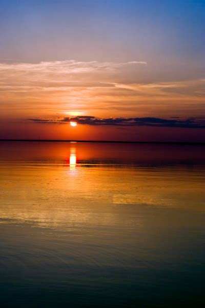 Sunset Over Water Stock Photo By ©avesun 3973901
