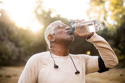 Senior African American Man Drinking Water Stock Photo Download Image