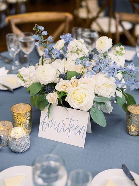 Flower Centerpiece With Blue Delphinium And Silver Mercury Glass