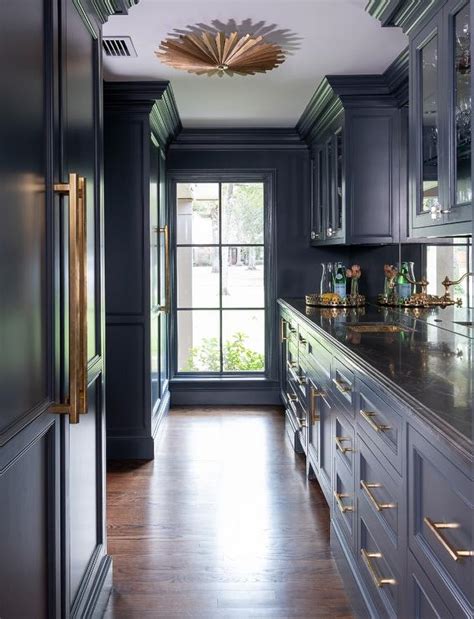 Gold And Blue Butlers Pantry With Black Leathered Marble Transitional
