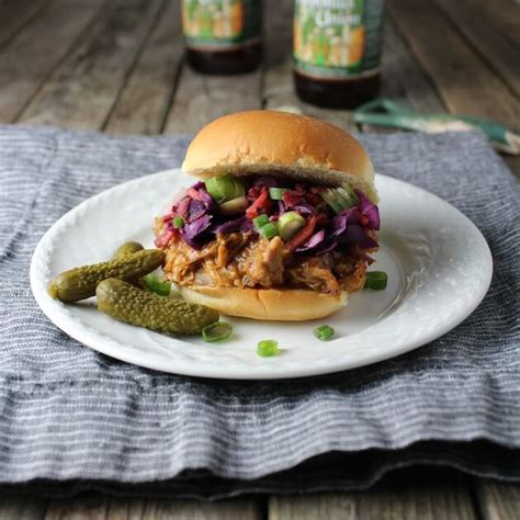 These skinny pulled pork sliders are super tender because they spend 6 hours cooking in the crock pot and the sauce incredible! BBQ Pulled Pork Sliders With Tangy Warm Cabbage Slaw (With ...