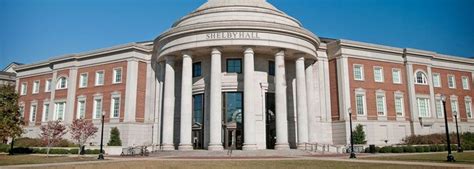 A Large Building With Columns And Arches On The Front Entrance To Its