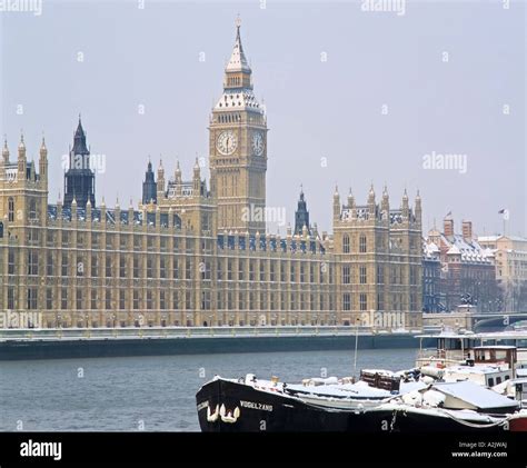 Snow Covered Winter Scene Of Big Ben And The Houses Of Parliament And
