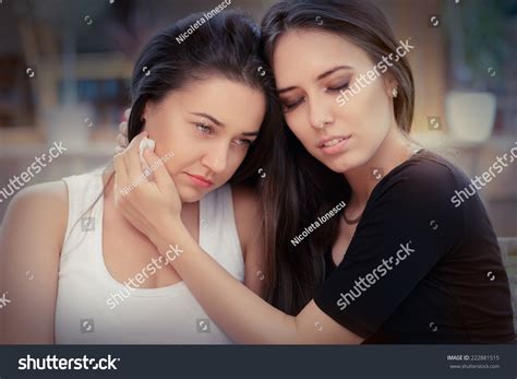 Young Woman Comforting Tearful Friend Portrait Stock Photo 222881515