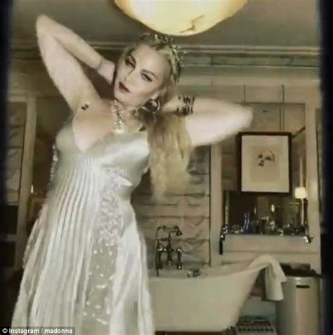 Madonna Exhibits Her Cleavage In Plunging Gown For Instagram Clip Daily Mail Online