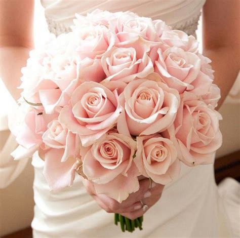 simple but very beautiful light pink wedding bouquet of roses that would look perfect with my
