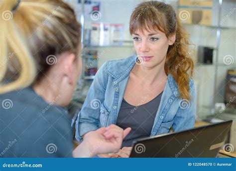 Vendor And Customer In Discussion In Store Stock Photo Image Of