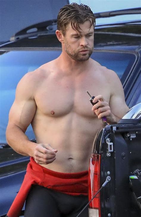chris hemsworth shows off bulging muscles in topless beach display photos au