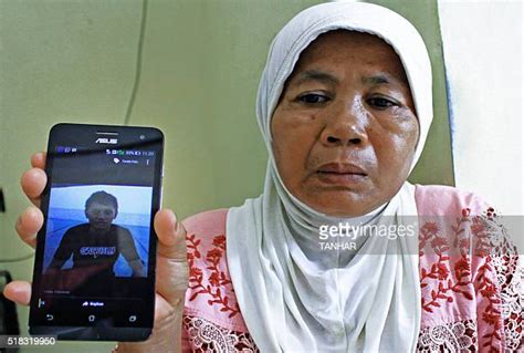 Son Showing Mom Phone Photos And Premium High Res Pictures Getty Images