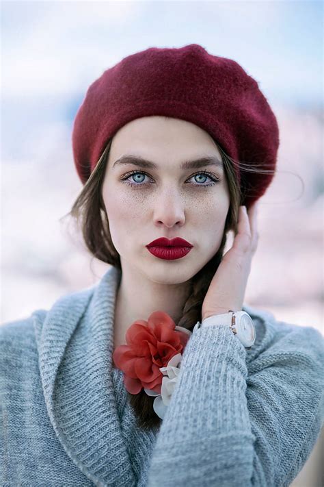 Young Beautiful Woman With Red Hat Blue Eyes And Freckles By Stocksy