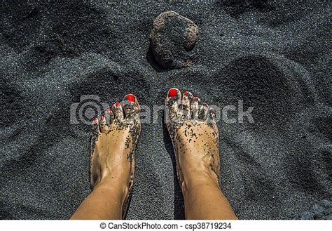 Female Bare Feet With Red Nails On Black Sand Beach In Tenerife Canstock
