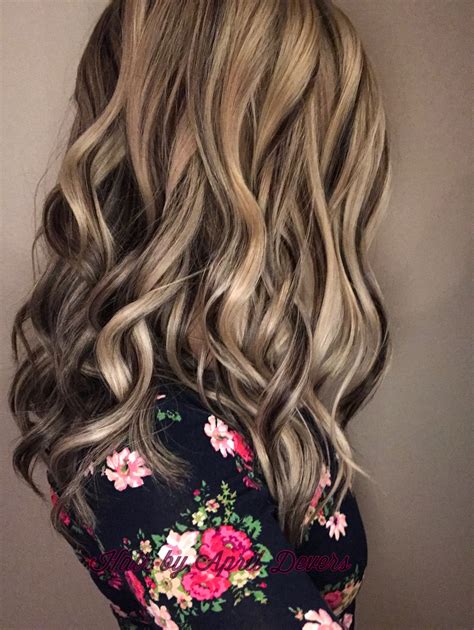 And for a strong contrast, that's not as harsh as platinum go for a sandy blonde shade. Platinum blonde with dark chocolate lowlights! Hair by ...