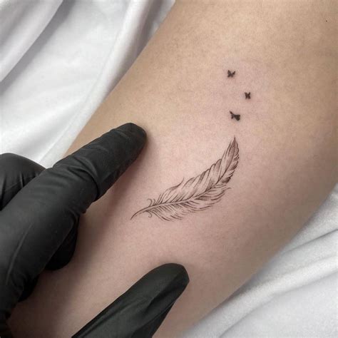 Fine Line Feather Tattoo On The Inner Forearm