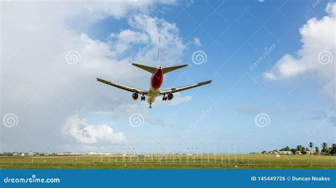 Jet Aeroplane Descending To Land At Airport Stock Photo Image Of