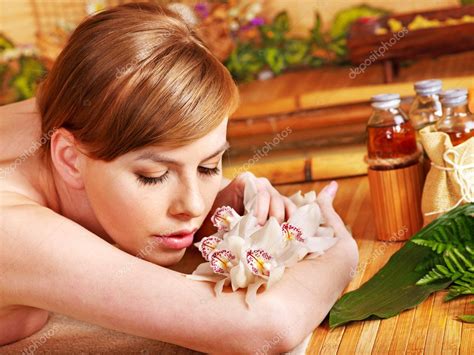 Woman Getting Massage In Bamboo Spa Stock Photo By Poznyakov