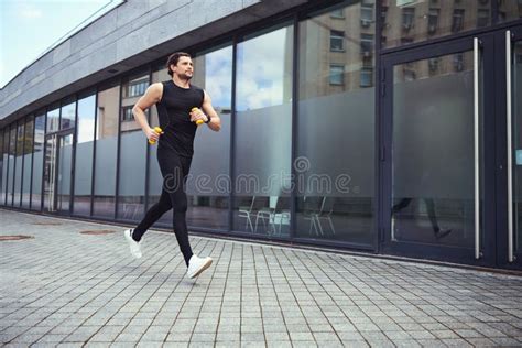 Young Active Man Running Down The Street Stock Photo Image Of