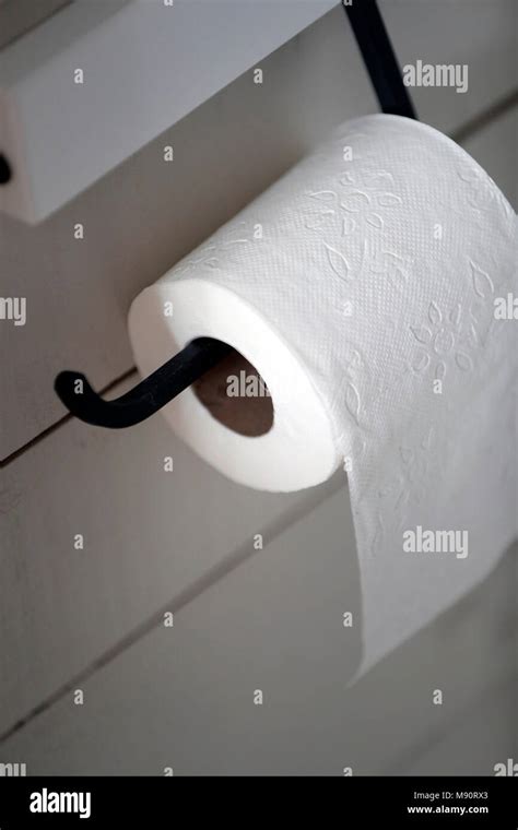 Rolled Toilet Paper Hanging In The Bathroom Stock Photo Alamy