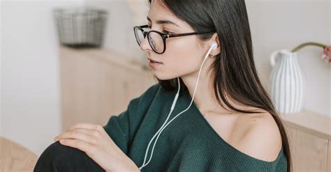 Young Woman Listening To Music In Earphones At Home · Free Stock Photo