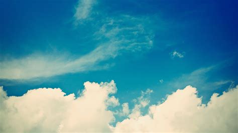 Fluffy White Clouds And A Blue Sky Hd Wallpaper