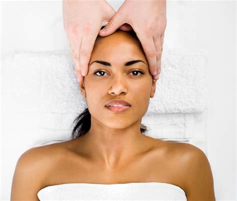 Premium Photo Beautiful Young Woman Receiving Facial Massage In A Spa Center