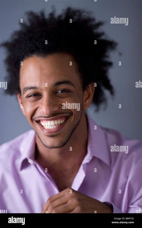 African American Man With Huge Afro Smiles Stock Photo Alamy