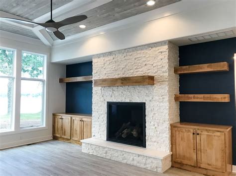 With stone fireplaces, it's important to find a mostly flat section to securely mount the cleat and the mantel to. This custom floor to ceiling stone fireplace is accented ...