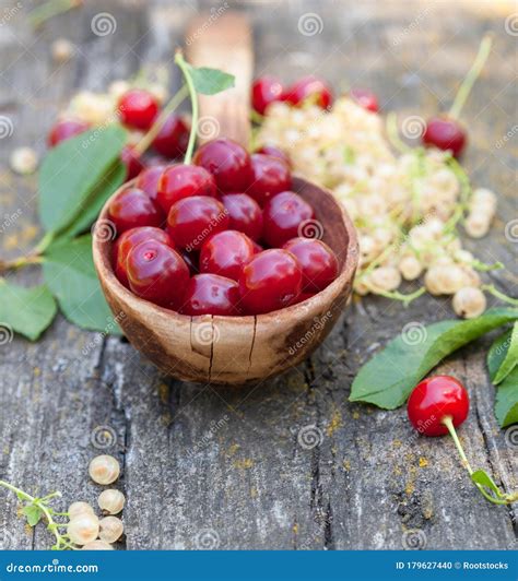 Red Sour Cherries In A Wooden Spoon Stock Photo Image Of Ladle Juice