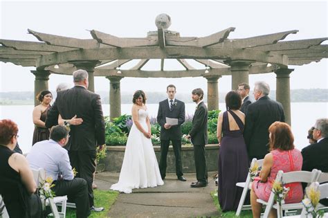 Bride And Groom During Lakeside Ceremony At The Oaks Lakeside