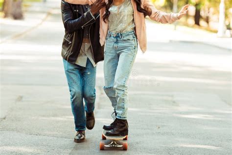 Boyfriend Helping Stretching His Girlfriend On A Road Stock Photo