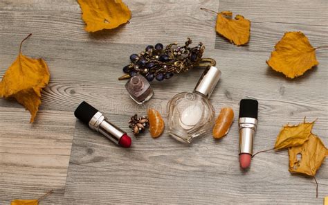 Cosmetics On A Wooden Background With Autumn Leaves Autumn Makeup
