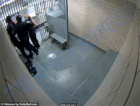 nypd cop is caught on security camera repeatedly punching shackled suspect after he flooded