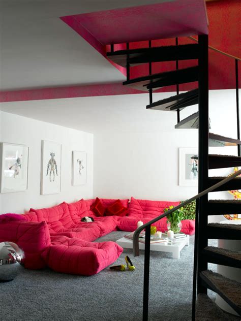 Pink Sofa In The Living Room With Spiral Staircase Interior Design