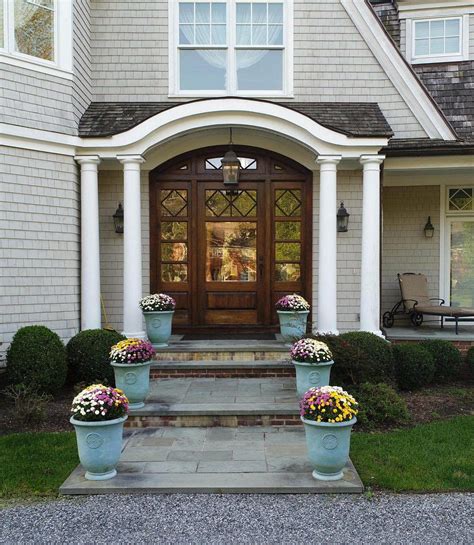 There are many faux substitutes in the stores but many homeowners prefer real wood. Beautiful wood front door & glass transoms & sidelights ...