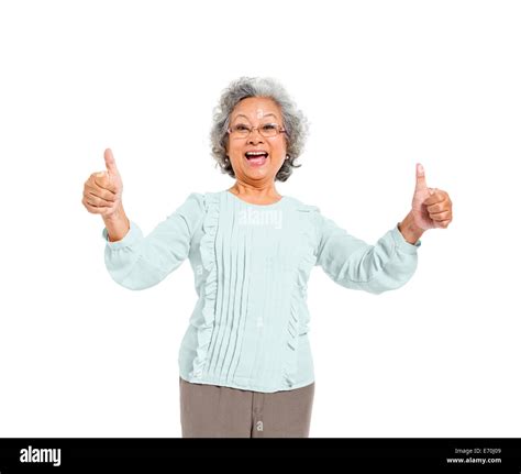 A Cheerful Old Casual Woman Giving A Thumbs Up Stock Photo Alamy