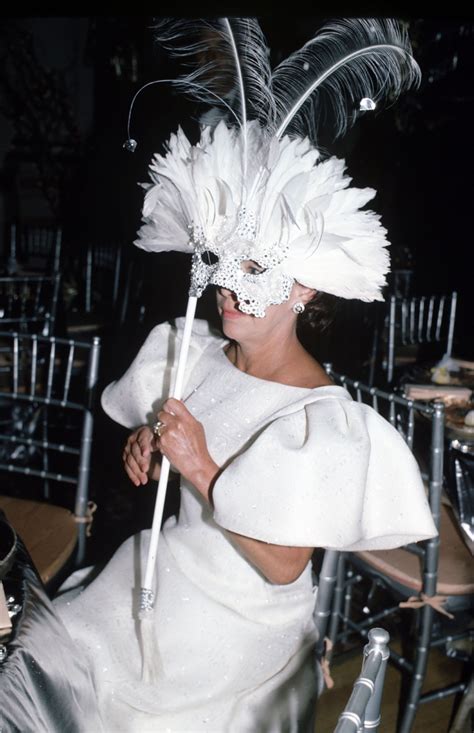 The Princess Wears An Elaborate Mask And Matching White Gown In 1990