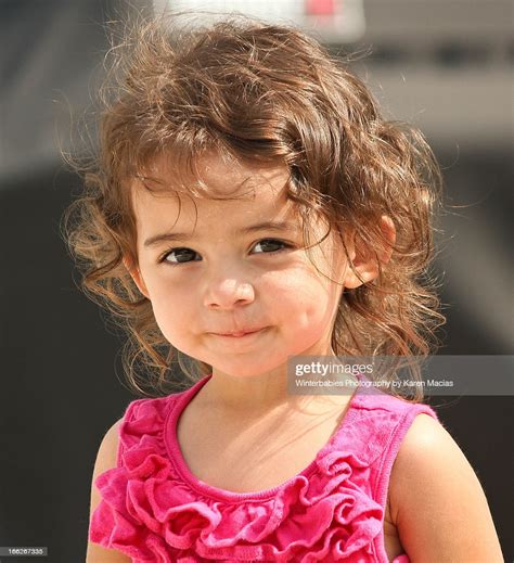 Few strands of hair from every section is picked up and tightened with a broad floral clip. 2 Year Old Girl Portrait Stock Photo | Getty Images