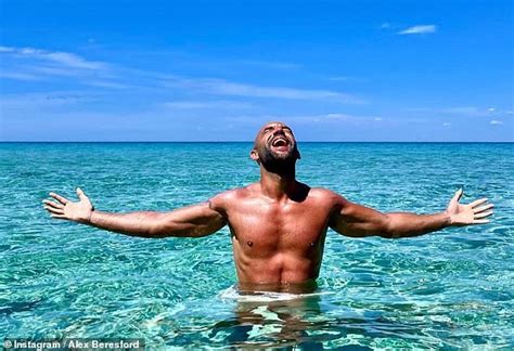 Alex Beresford Shows Off His Ripped Physique In Shirtless Snaps As He Enjoys A Festive Beach