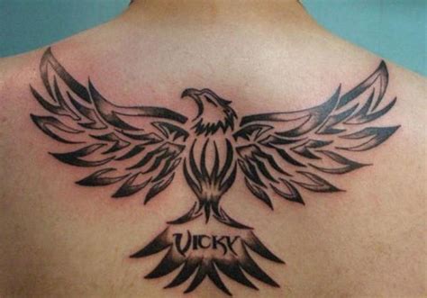 Vicky Black Tribal Flying Eagle Tattoo On Man Upper Back