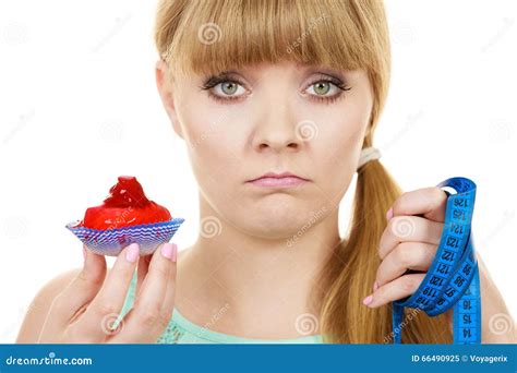 Woman Holds Cupcake Trying To Resist Temptation Stock Image Image Of Sweet Weight 66490925