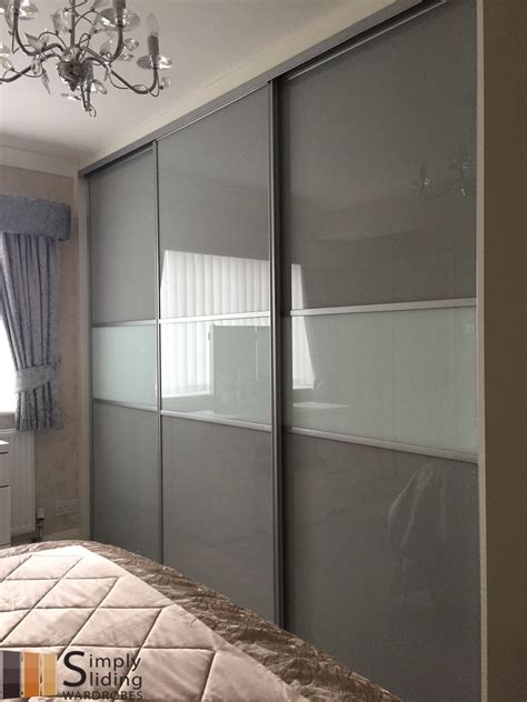 One Of Our Multi Panel Grey Glass Sliding Door Wardrobes Wardrobe