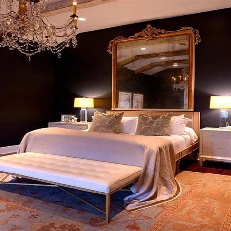 Master Bedroom With Black Walls A Lovely Chandelier And Large Mirror