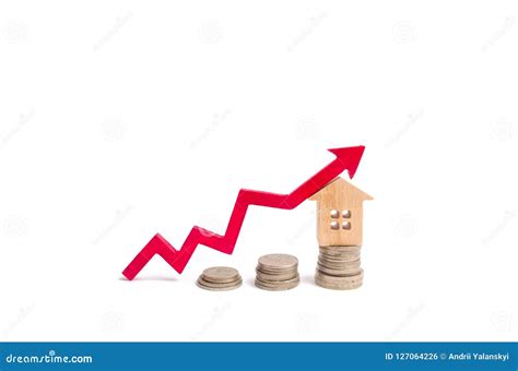 House on Penny and Arrow Up. the Concept of a Rise in Price of Property