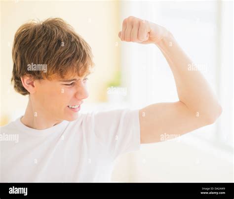 Teenage Boy Flexing Muscles Hi Res Stock Photography And Images Alamy