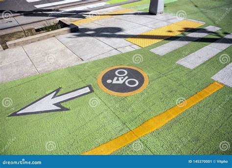 Green Bike Lane With Road Markings For Cyclists Royalty Free Stock