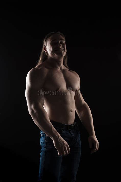 Naked Torso Male Bodybuilder Athlete With Long Blond Hair In Studio