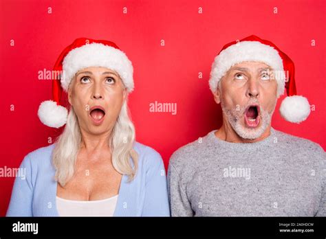 portrait of two nice shocked impressed people grey haired married spouses husband wife grandma